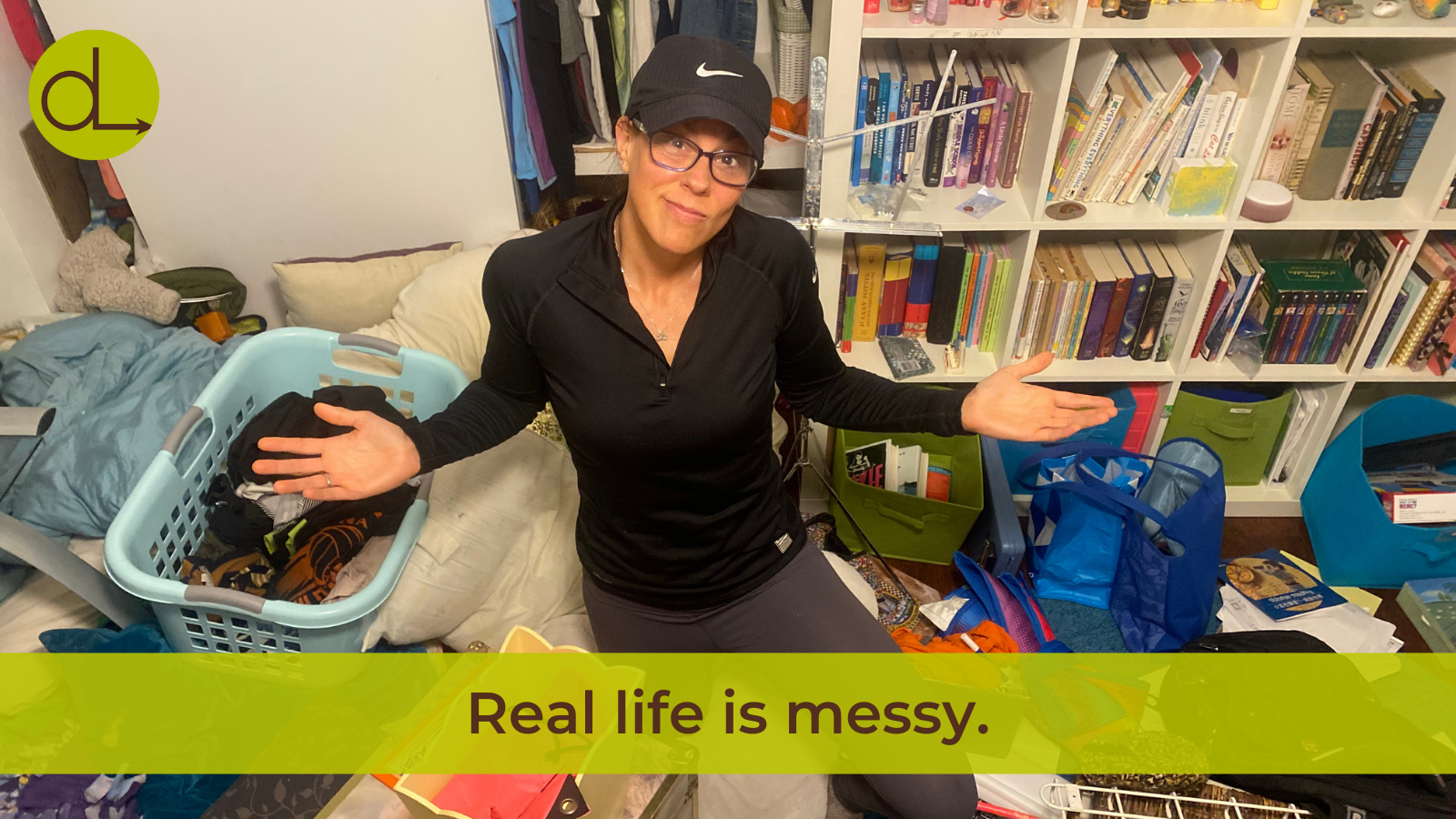 Darcy sitting in a messy room, shrugging, with the caption "Real life is messy."