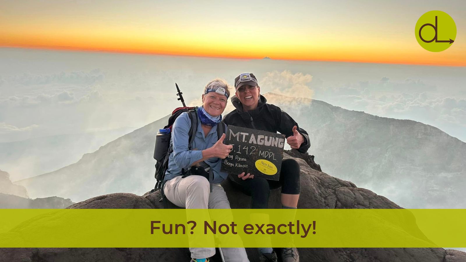 Darcy Luoma and friend on top of a mountain at sunrise