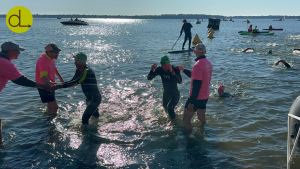 People getting out of the lake after swimming in the Iron Man